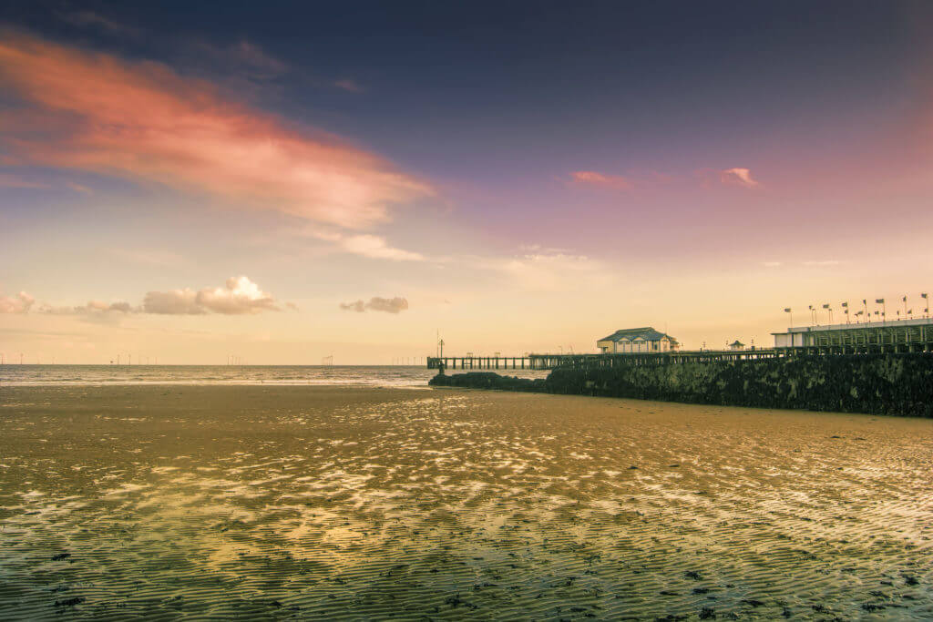 Seaside during sunset in Clacton-on-Sea in England.