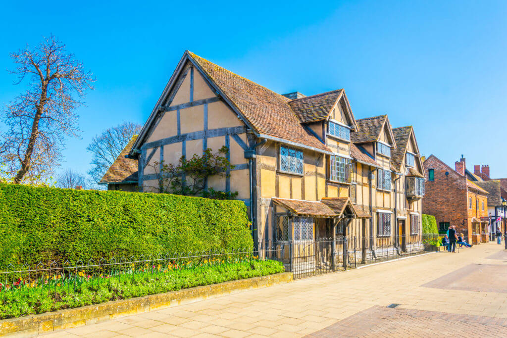 People are strolling next to the birth house of William Shakespeare in Stratford upon Avon, England