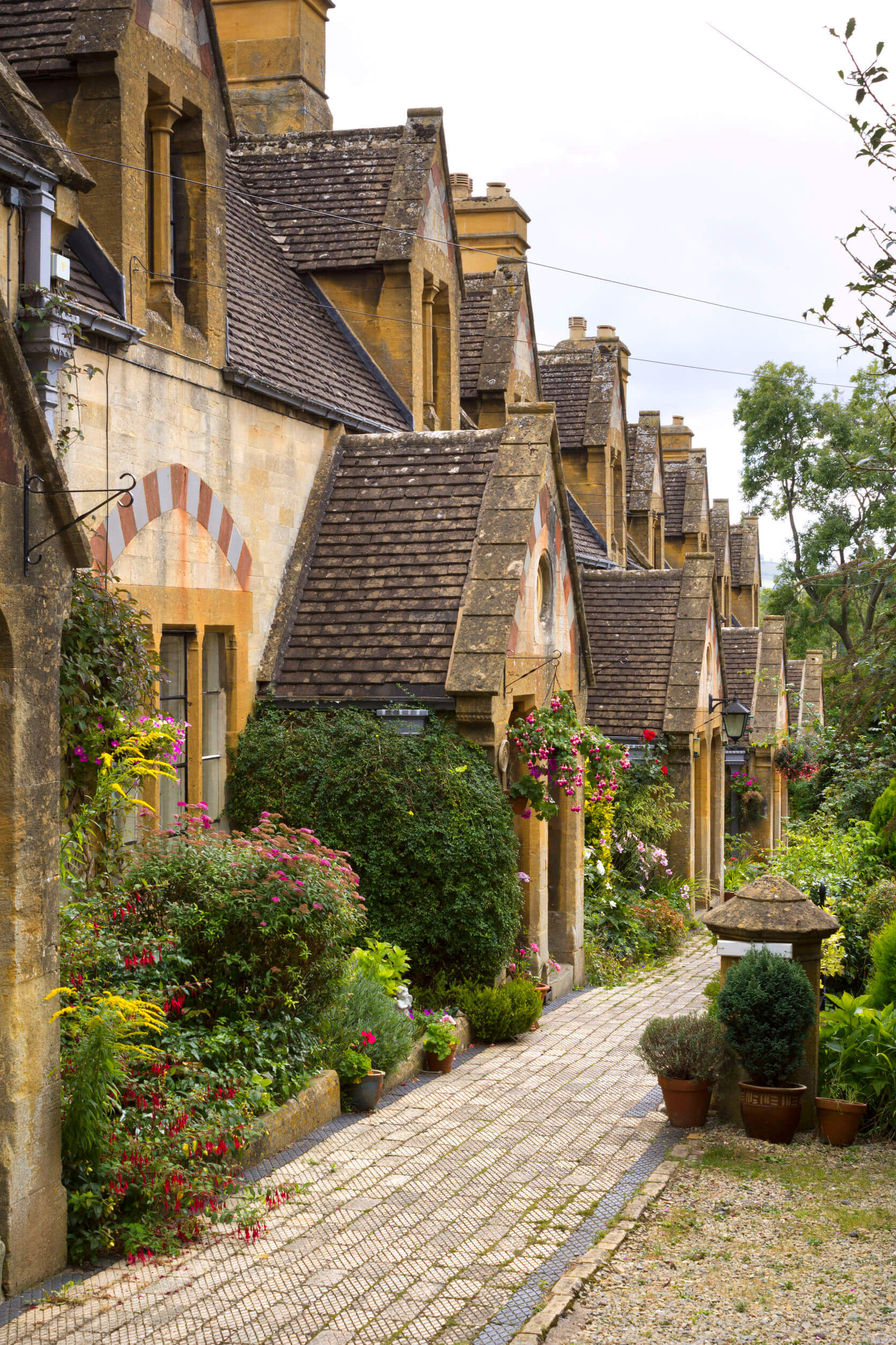 A row of picturesque Cotswold cottages in Winchcombe, Gloucestershire, UK.