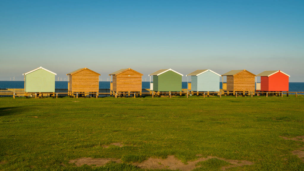 Beach huts with sea view in Leysdown-on-Sea, Isle of Sheppey, Kent, England, UK