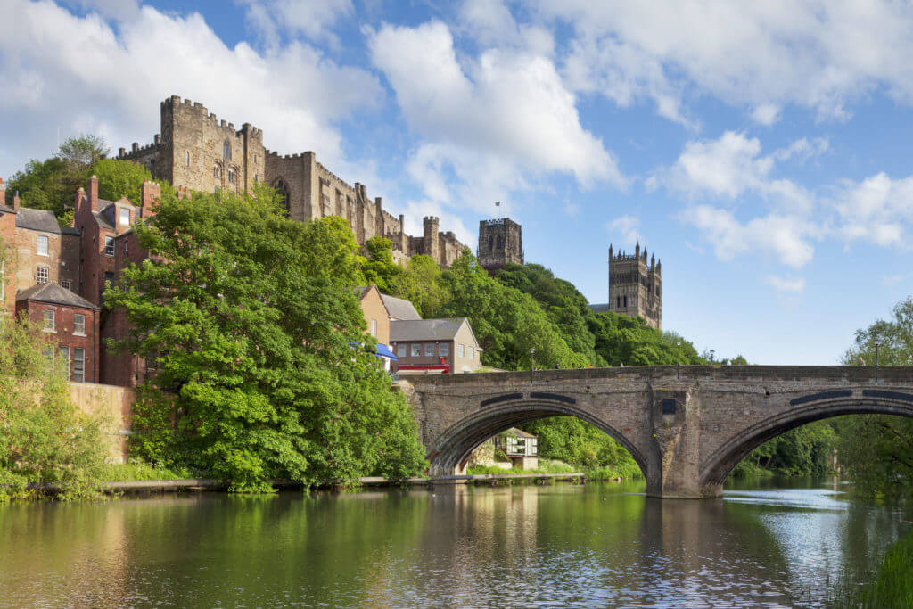 Durham Castle and Cathedral on their rock above the city, and Framwellgate Bridge spanning the River Wear