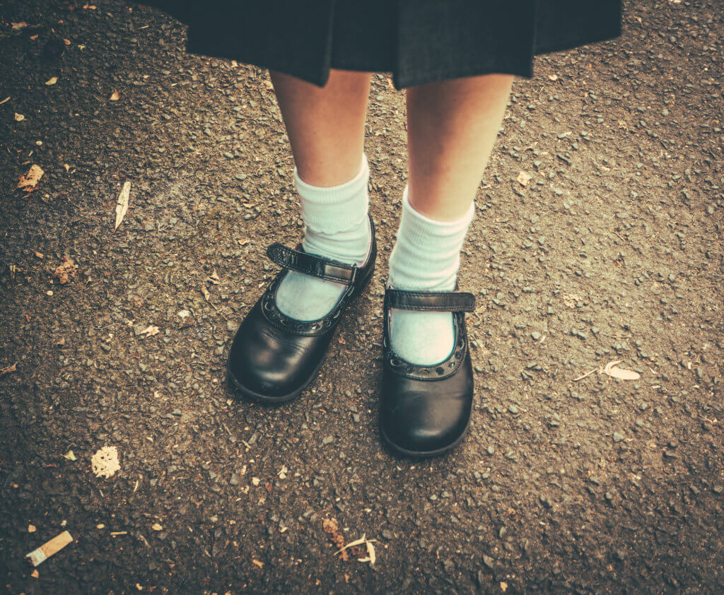 Retro Style Image Of School Girl's Feet In Uniform
