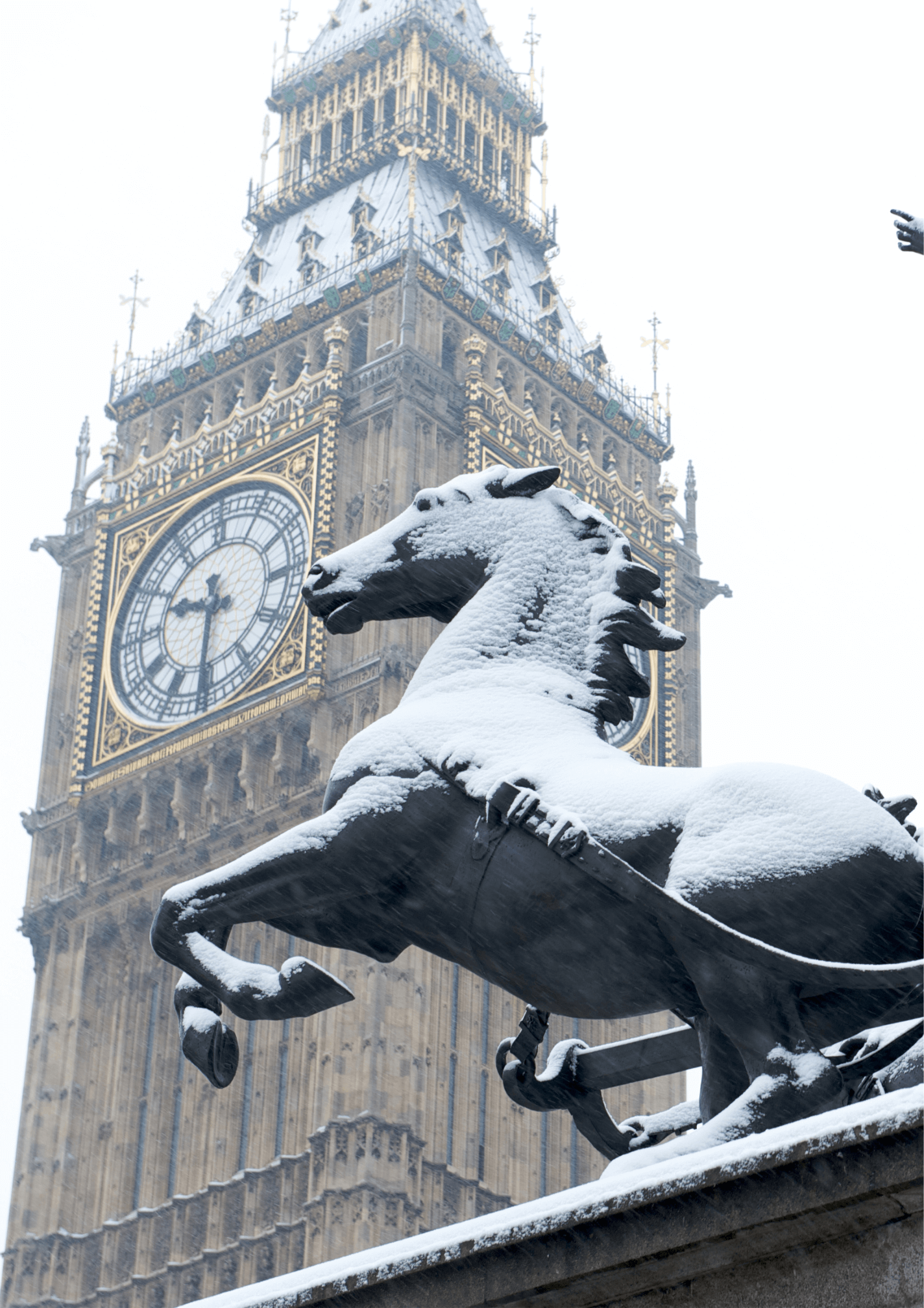 Snow on a statue in London, Big Ben, England
