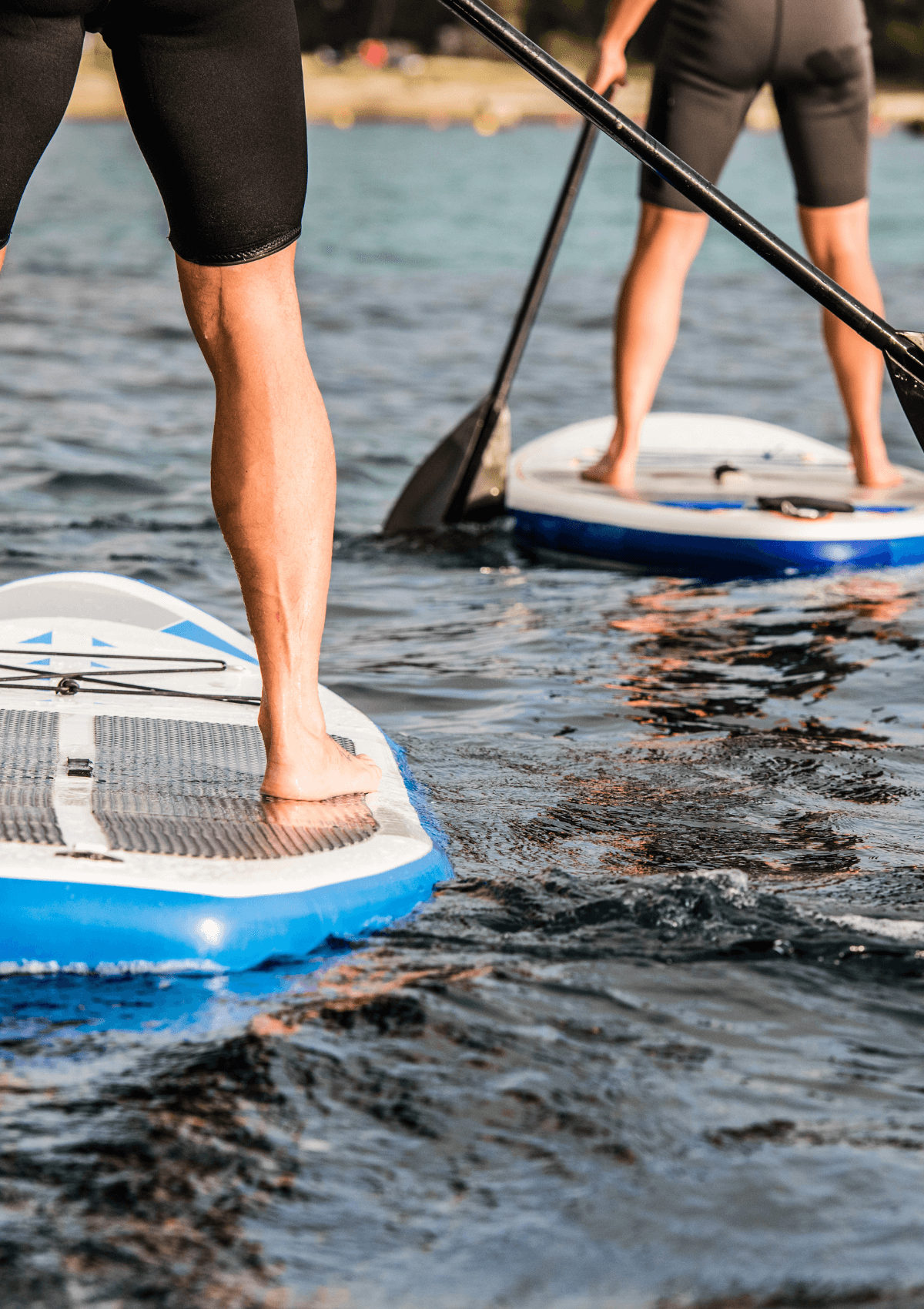 Two people paddleboarding 