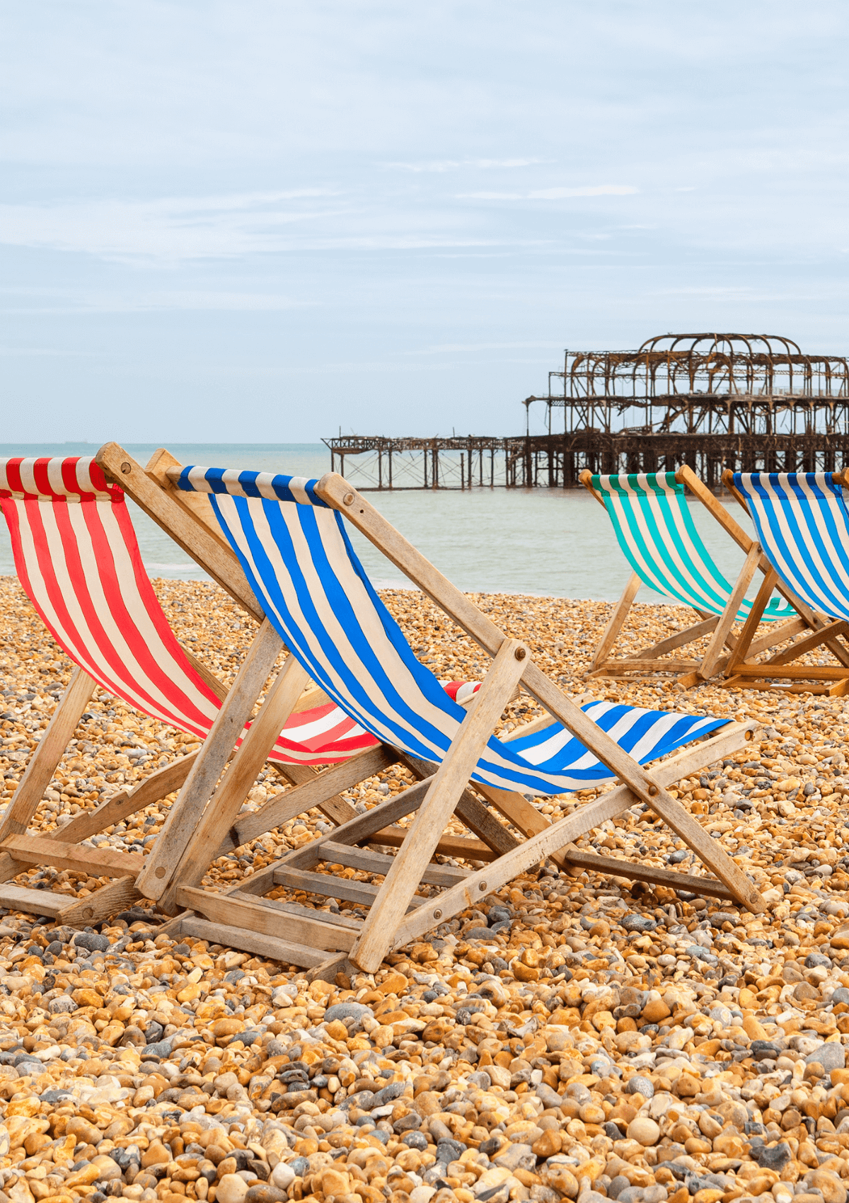 Brighton beachfront with deck chairs, England