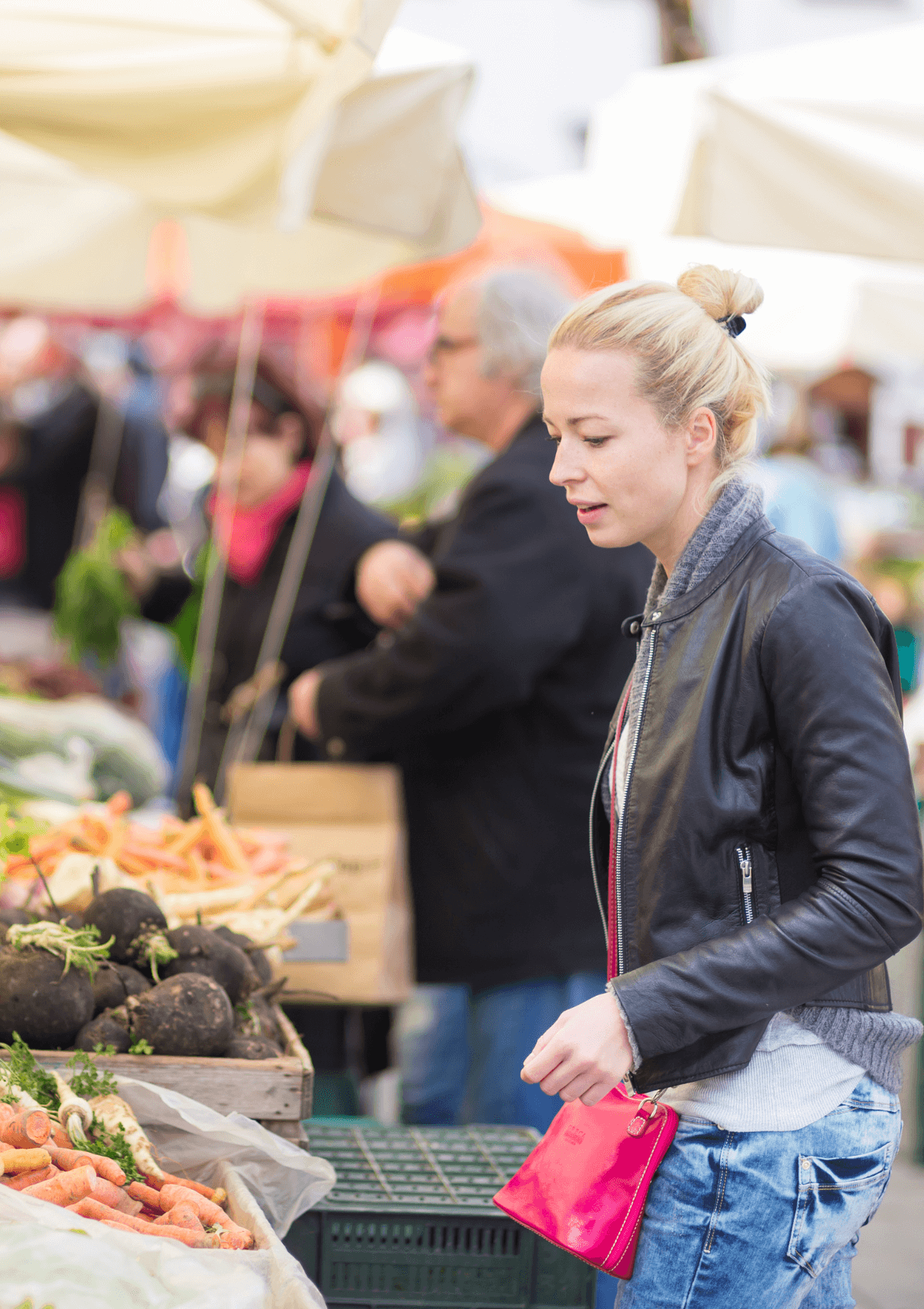 Woman shopping at local market stall