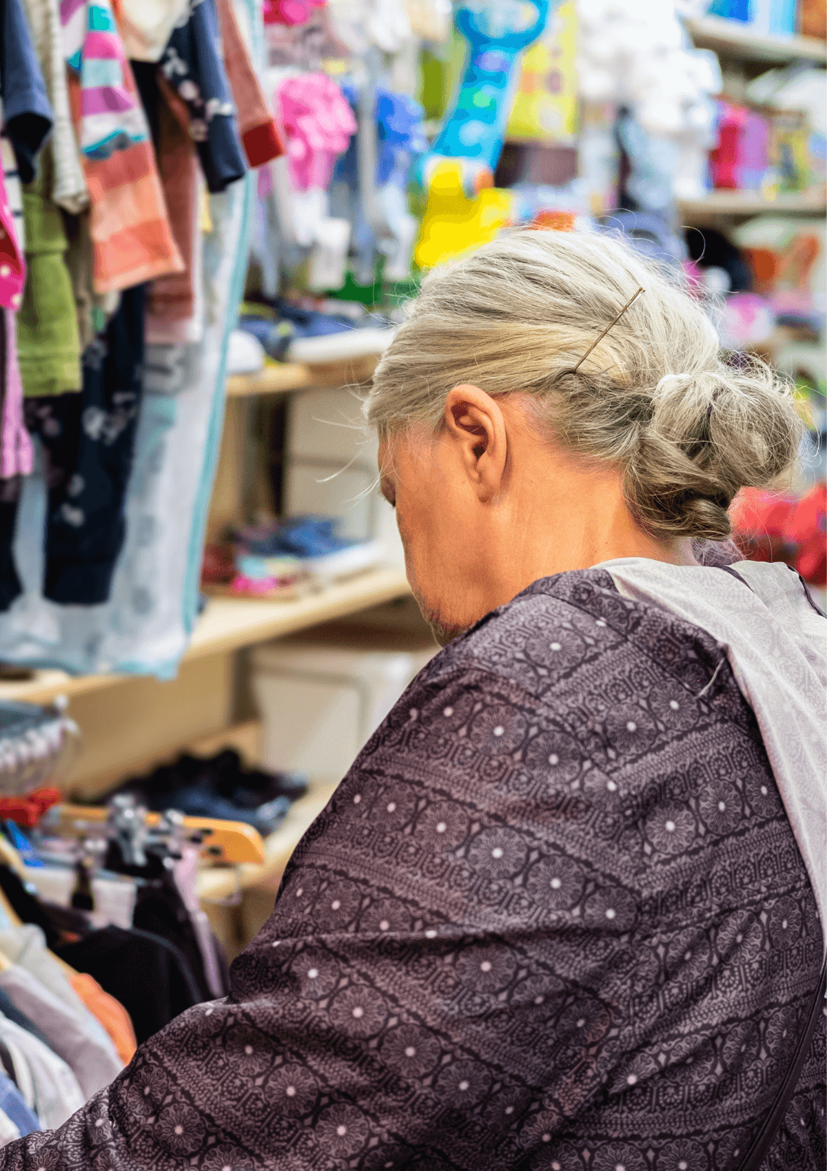 Woman shopping in charity shop